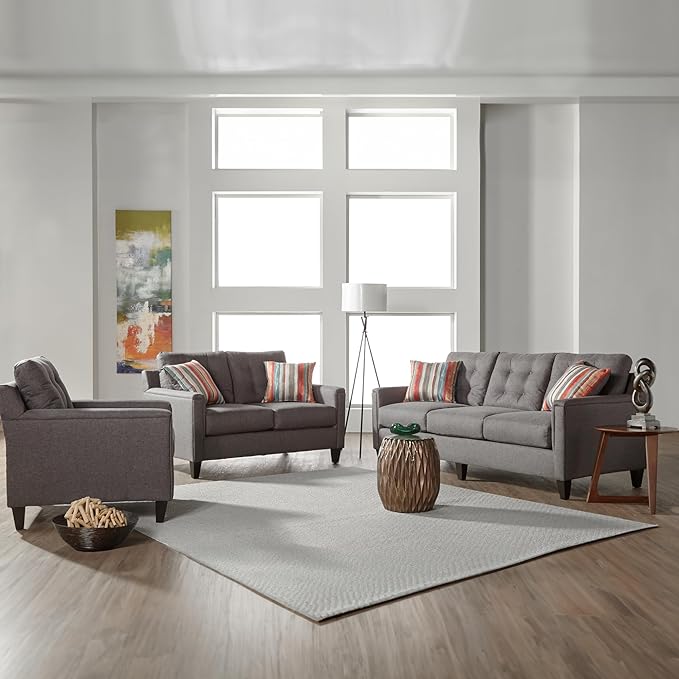 A grey loveseat sofa and chair sit in a living room