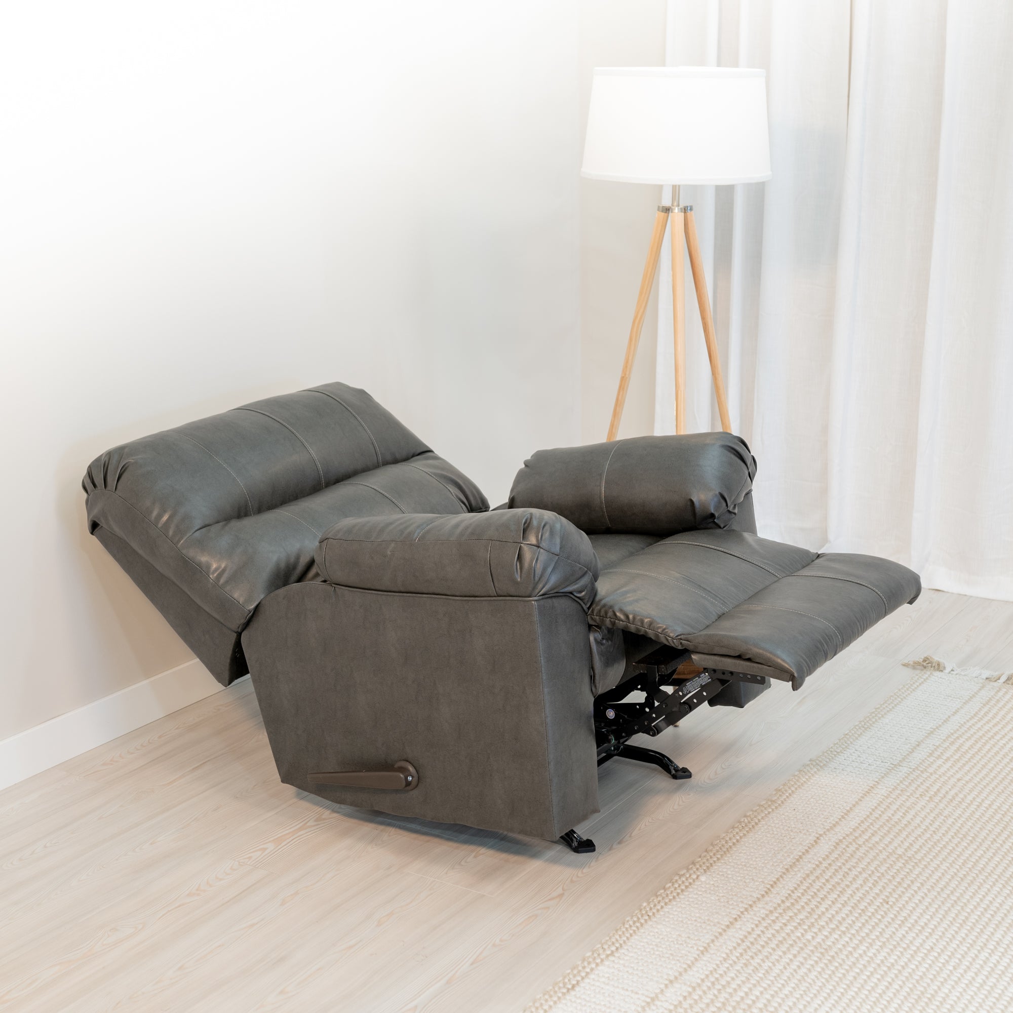 An angled view of the recliner showing it fully reclined with an extending foot rest.