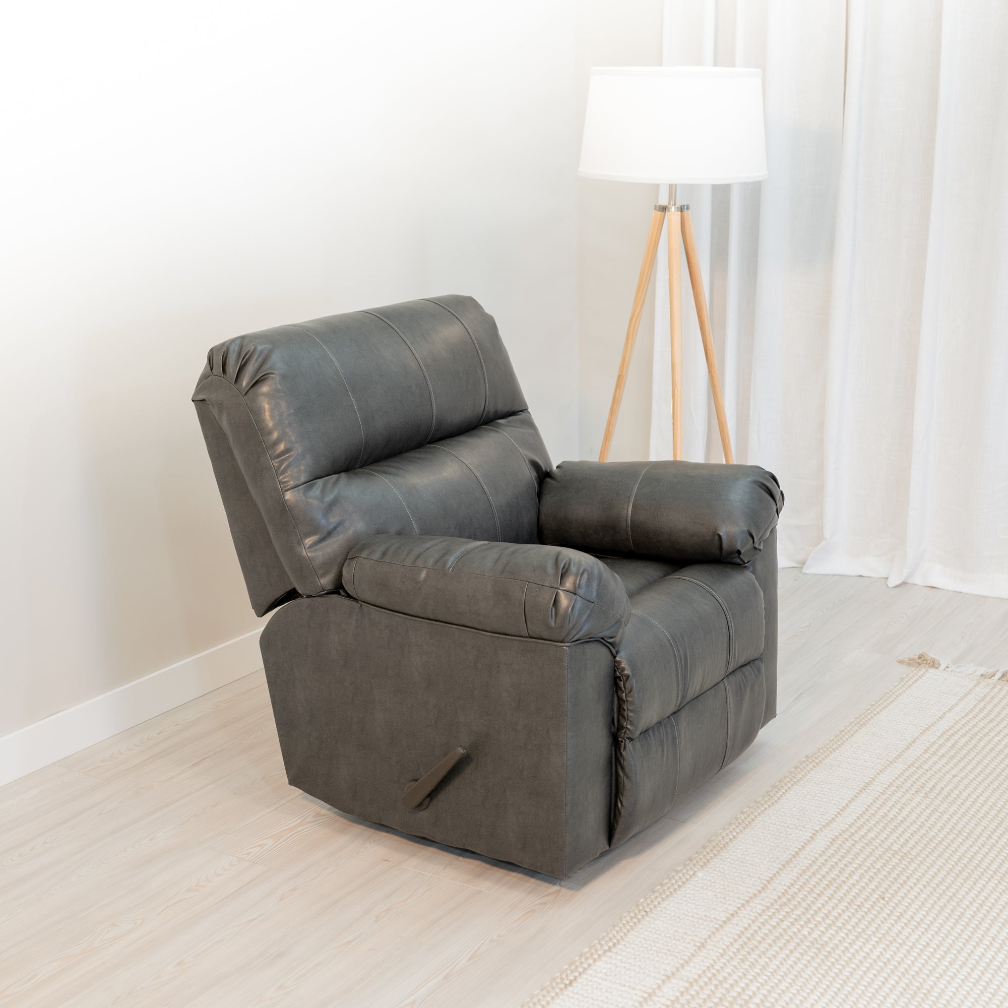 angled view of An overstuffed recliner sits in a comfortable looking living room