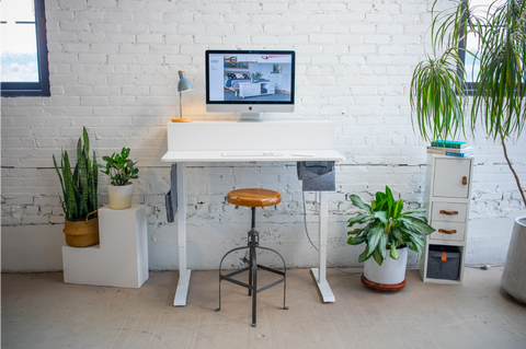 stylish desk in sunny loft